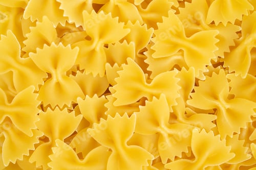Preview: Italian pasta farfalle background. Top view.
