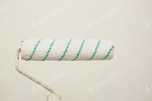 Preview: painting wall with paint roller. Painting apartment, renovating with white color paint. Room