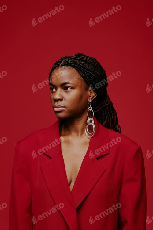 Preview: Looking Away with Composed Expression Wearing Red Blazer