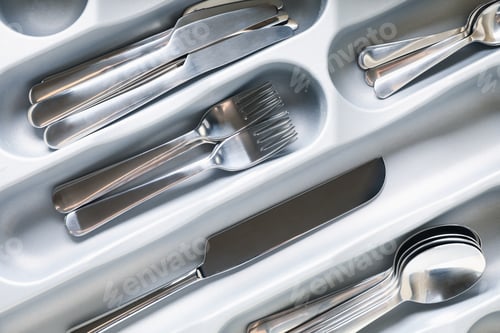 Preview: Set of different cutlery on whole background, close up