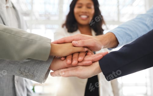 Preview: Group of businesspeople stacking their hands together in an office at work. Business professionals