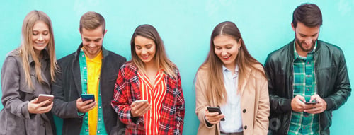 Preview: A group of people standing with their smartphones in hand and enjoying online stuff