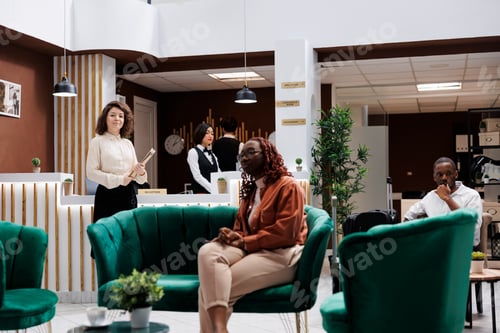 Preview: Hotel manager with employees and guests