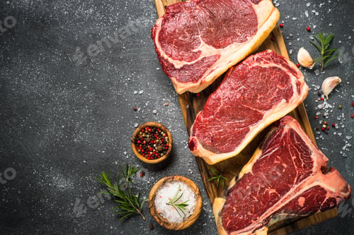 Preview: Raw meat beef steak on black top view