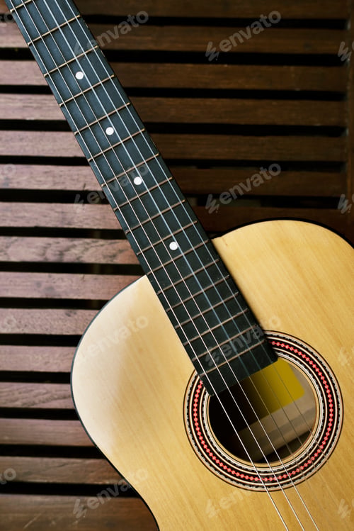 Preview: Acoustic guitar on a wooden floor