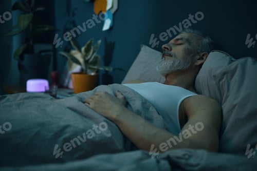 Preview: Sleeping Senior Man Resting Peacefully in Bedroom