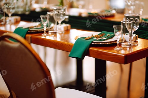 Preview: Banquet table in the restaurant, preparation before the banquet. The work of professional florists.
