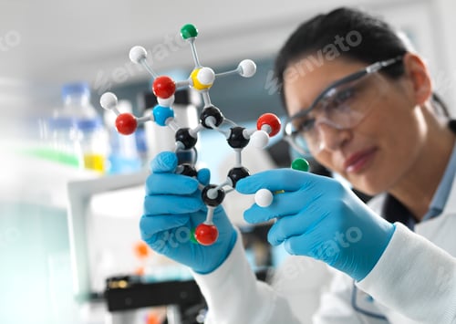 Preview: Biotech Research, Scientist examining a ball and stick molecular model