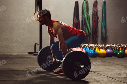 Preview: Caucasian man lifting a barbell.
