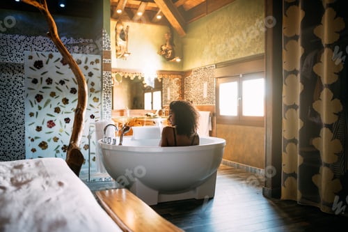 Preview: Young woman relaxing in the hydro massage bath
