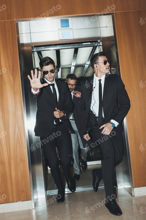 Preview: bodyguard obstructing paparazzi when celebrity going out from elevator