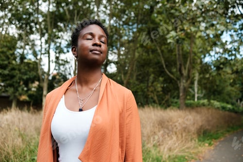 Preview: Black woman enjoying a day in the park.