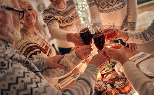 Preview: The happy family clink glasses above the christmas table
