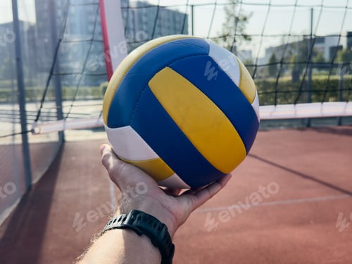 Preview: volleyball. blue with yellow color ball on the playground. volleyball cover, red. ball game