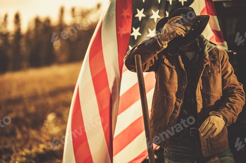 Preview: American Cowboy Rancher in Front of National United States Flag