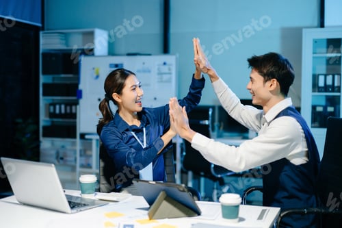 Preview: Asian business team celebrating success with high five, showing teamwork,