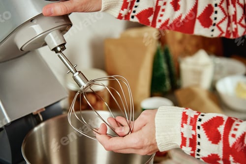 Preview: Woman cooking at home kitchen, use electric mixer to preparing dough