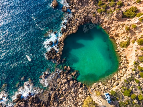 Preview: Aerial view of of a small sea crater surrounded by rocks, Voulolimni, Crete