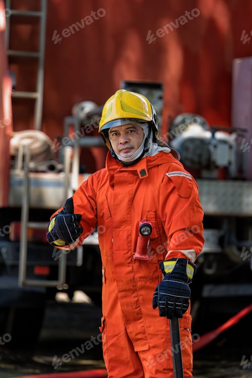 Preview: Fireman wearing fire protection suite and oxygen tank exercise hold axe thumb up stand portrait