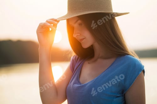 Preview: Woman with a Hat in the Golden Sunset Light