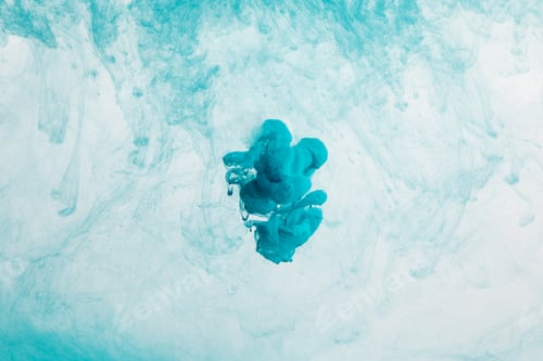 Preview: Close up view of blue paint swirls and splash in water