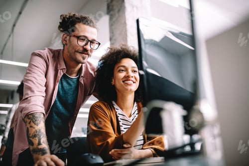 Preview: Happy young business people colleagues talking working in office