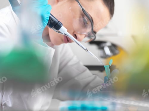 Preview: Scientist pipetting DNA sample in tubes