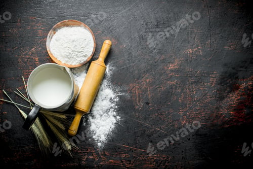 Preview: Flour with spikelets, rolling pin and milk in a jug.