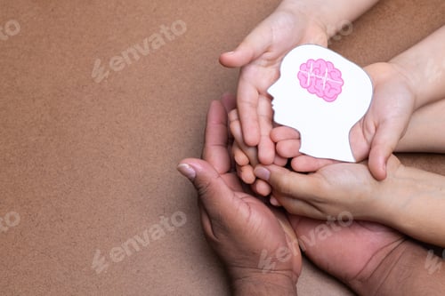 Preview: hands holding head image with pink brain, chocolate background