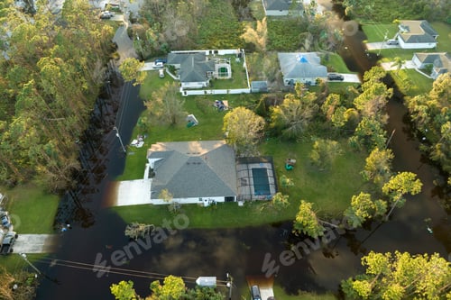 Preview: Heavy flood with high water surrounding residential houses after hurricane rainfall