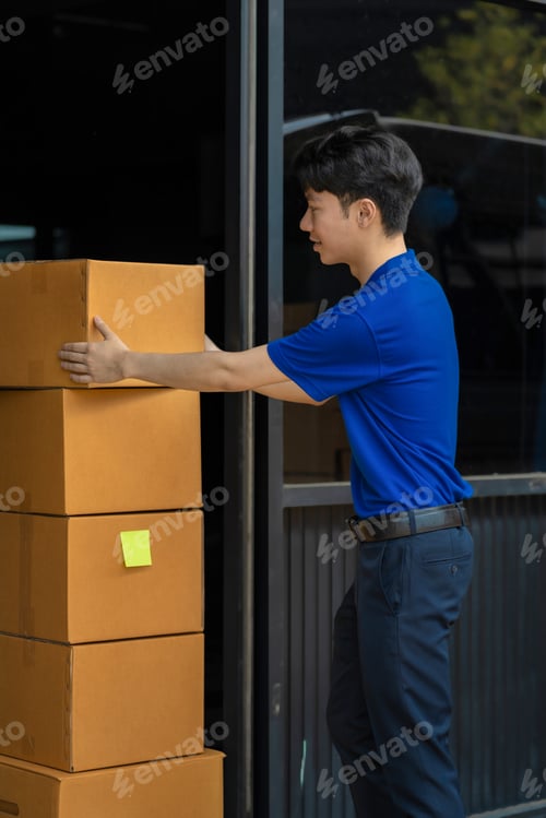 Preview: Asian delivery man work in truck for checking the product in the truck, concept ecommerce.