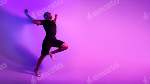 Preview: Black Athlete Man Running Celebrating Victory Shouting Over Purple Background