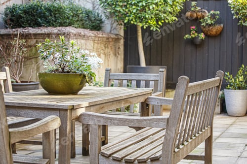 Garden Furniture on a Patio with Flowers