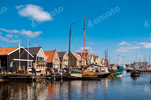 Preview: Urk Flevoland Netherlands sunset at the lighthouse and harbor of Urk Holland