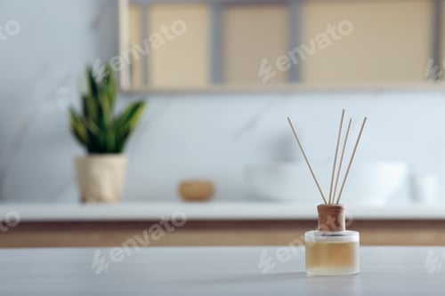 Preview: Aromatic reed air freshener on table indoors. Space for text