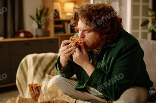 Preview: Bearded Man Enjoying Pizza in Cozy Living Room
