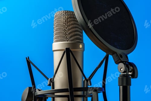 Preview: Professional microphone stand over blue studio background