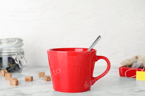 Preview: Cup of delicious hot tea on table
