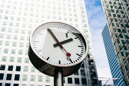Preview: Street clock with tall building on the background