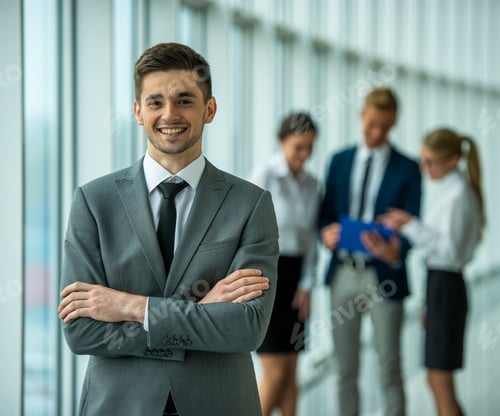 Preview: Confident businessman with team in background.