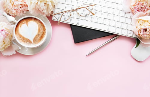 Preview: Flat lay top view women's office desk with flowers.