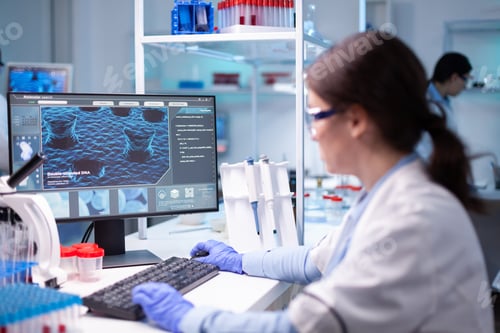 Preview: Woman biotechnology scientist researching in development laboratory