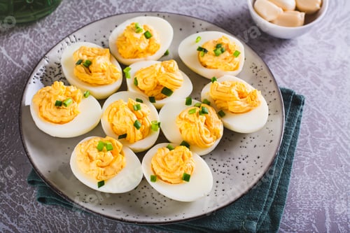 Preview: Boiled eggs stuffed with yolk, cheese, garlic and mayonnaise on a plate