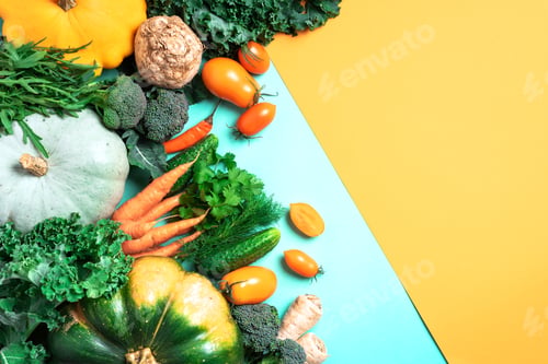Preview: Vegan and vegetarian diet, harvest concept. Autumn vegetables on trendy yellow and green background