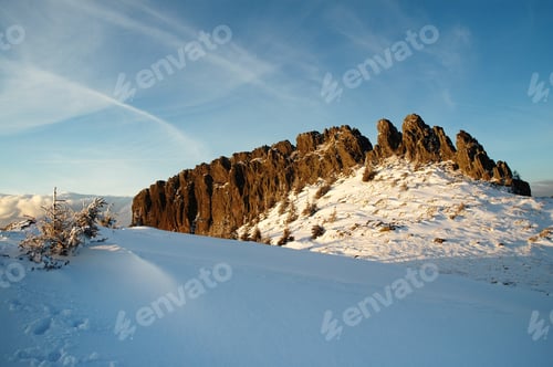 Preview: Mountain top. Snowy peak in late afternoon lights. Creasta Cocosului, Romania