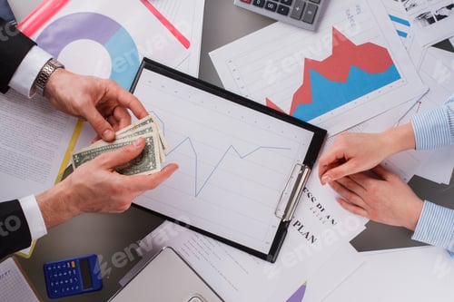 Preview: Hands of business people working with documents.