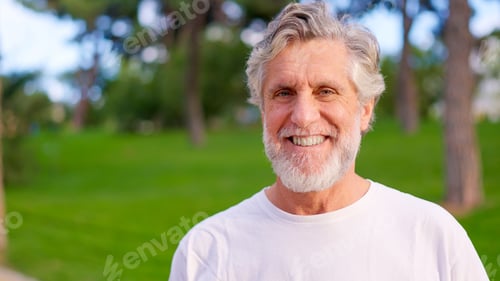 Preview: Smiling Man Portrait in a Sunny Outdoor Setting