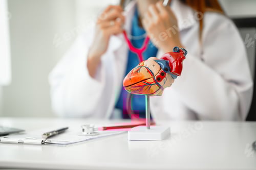 Preview: Female doctor provides crucial guidance to a male patient in clinic room, heart attack prevention