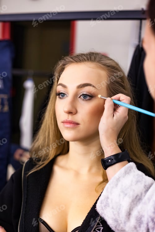 Preview: Pretty young woman visit make up artist, lady doing stylish makeup in beauty salon