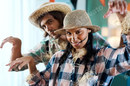 Preview: Happy Halloween. Shot of a young couple dressed in halloween costumes being being playful at home.